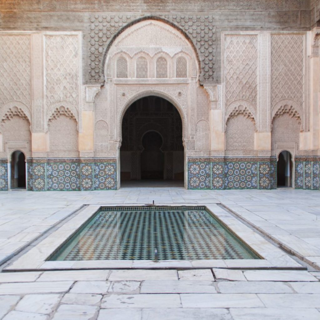 view-of-a-courtyard-of-an-islamic-palace-in-morocco-small-pool-in-the-centre-marble-and-amazing-do.jpg